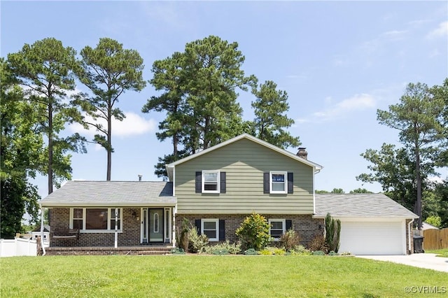 406 Windmere Dr, Colonial Heights, VA 23834 - split level home with brick siding, an attached garage, driveway, a porch, and a chimney
