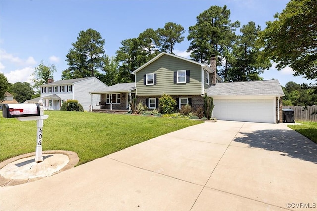 406 Windmere Dr, Colonial Heights, VA 23834 - split level home featuring driveway, brick siding, a garage, and a chimney