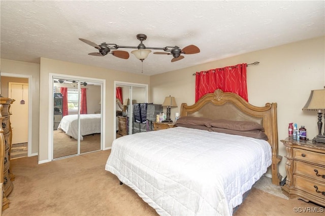 406 Windmere Dr, Colonial Heights, VA 23834 - bedroom featuring light carpet, multiple closets, and ceiling fan