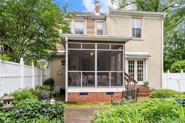 1520 Bellevue Ave, Richmond, VA 23227 - back of house featuring a sunroom, stucco siding, crawl space, and a fenced backyard