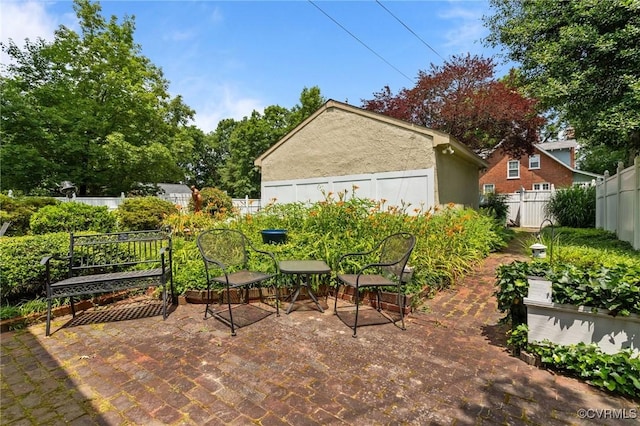 1520 Bellevue Ave, Richmond, VA 23227 - fenced backyard with a patio area
