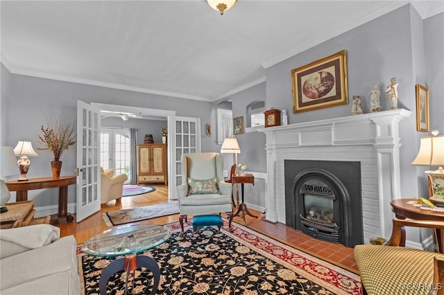 1520 Bellevue Ave, Richmond, VA 23227 - living room featuring french doors, wood finished floors, crown molding, and a fireplace