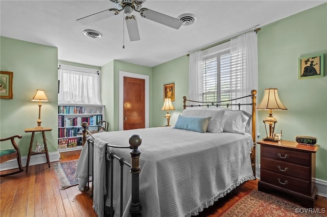 1520 Bellevue Ave, Richmond, VA 23227 - bedroom featuring multiple windows, wood-type flooring, and ceiling fan