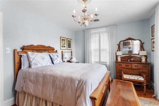 1520 Bellevue Ave, Richmond, VA 23227 - bedroom featuring a chandelier and wood finished floors