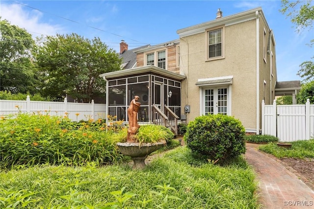 1520 Bellevue Ave, Richmond, VA 23227 - back of house featuring a chimney, a sunroom, stucco siding, and french doors