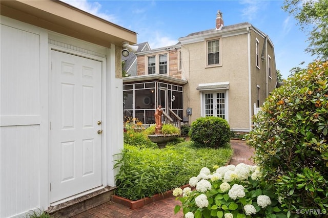 1520 Bellevue Ave, Richmond, VA 23227 - back of house with a sunroom and stucco siding
