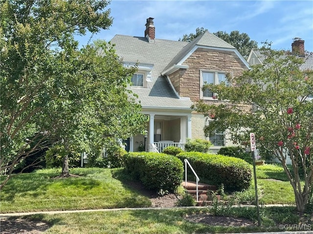 1520 Bellevue Ave, Richmond, VA 23227 - view of front of property with a front yard, a chimney, and stone siding