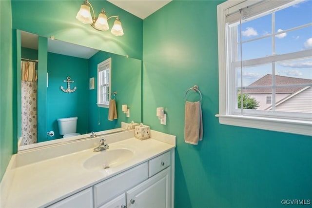 8390 Bink Pl, Mechanicsville, VA 23111 - bathroom with toilet, vanity, plenty of natural light, and curtained shower