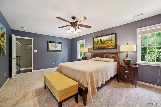8390 Bink Pl, Mechanicsville, VA 23111 - bedroom featuring carpet floors, baseboards, multiple windows, and a ceiling fan