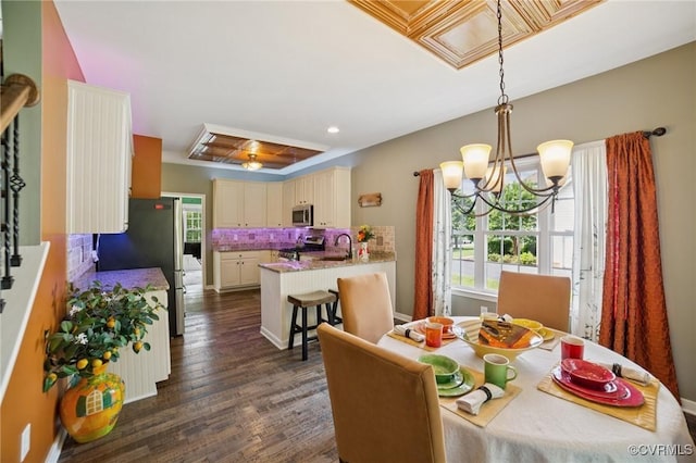 8390 Bink Pl, Mechanicsville, VA 23111 - dining room with dark wood-style floors, a chandelier, and recessed lighting