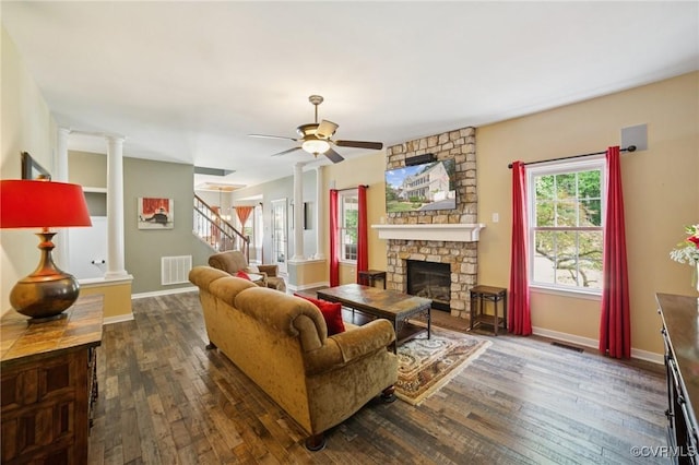 8390 Bink Pl, Mechanicsville, VA 23111 - living room featuring dark wood-style flooring, a stone fireplace, stairway, ceiling fan, and baseboards