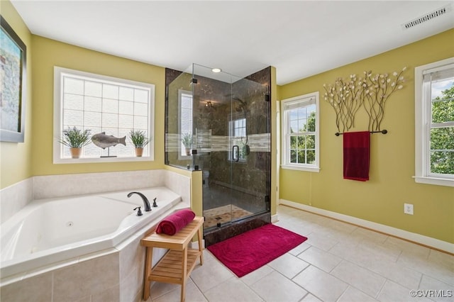 8390 Bink Pl, Mechanicsville, VA 23111 - bathroom with a tub with jets, a stall shower, tile patterned flooring, and baseboards
