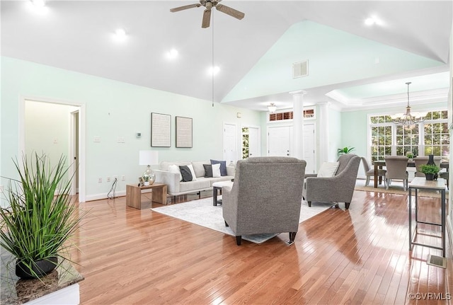 2017 Valley Springs Ct, Powhatan, VA 23139 - living room featuring ornate columns, light wood-type flooring, ceiling fan, a chandelier, and high vaulted ceiling