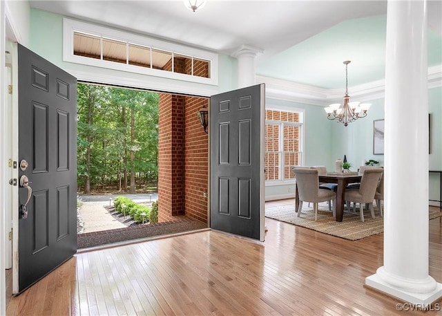 2017 Valley Springs Ct, Powhatan, VA 23139 - entrance foyer with ornate columns, wood-type flooring, a chandelier, and ornamental molding