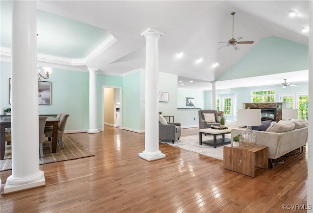 2017 Valley Springs Ct, Powhatan, VA 23139 - living room with ceiling fan, decorative columns, light wood finished floors, a fireplace, and high vaulted ceiling