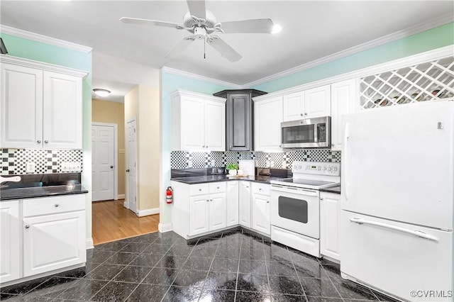 2017 Valley Springs Ct, Powhatan, VA 23139 - kitchen with white appliances, granite floors, dark countertops, white cabinets, and crown molding