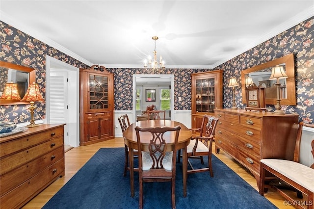 13211 Powderham Ln, Midlothian, VA 23113 - dining area with wallpapered walls, light wood-type flooring, wainscoting, crown molding, and a chandelier