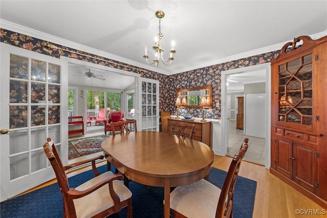 13211 Powderham Ln, Midlothian, VA 23113 - dining area featuring wallpapered walls, light wood-style floors, crown molding, a chandelier, and a ceiling fan
