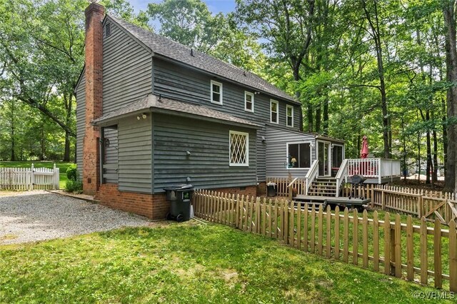 13211 Powderham Ln, Midlothian, VA 23113 - back of house featuring a chimney, a deck, a sunroom, and a shingled roof