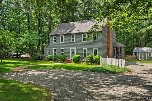 13211 Powderham Ln, Midlothian, VA 23113 - colonial-style house featuring a chimney and roof with shingles
