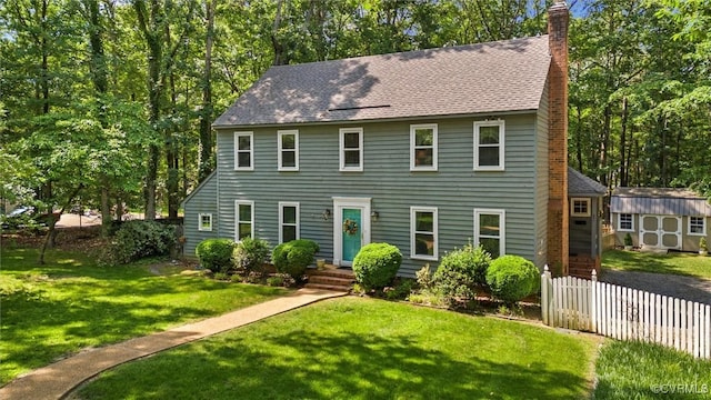 13211 Powderham Ln, Midlothian, VA 23113 - colonial house featuring a chimney and roof with shingles