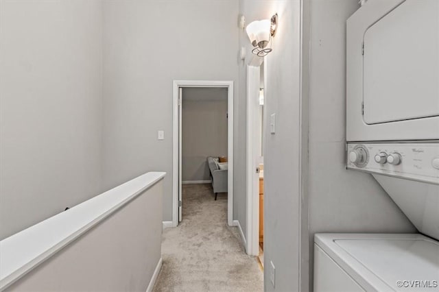 2990 Woodbridge Crossing Dr, Midlothian, VA 23112 - washroom featuring stacked washing machine and dryer and light colored carpet