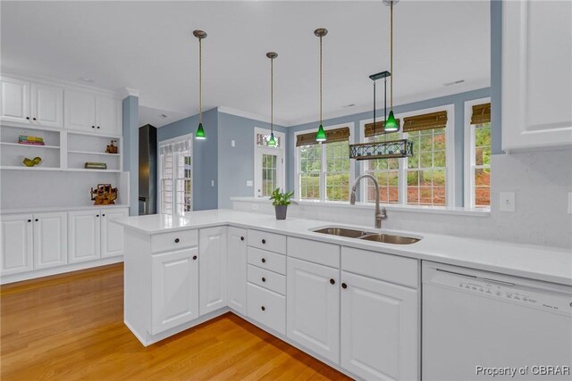 118 Old Field Rd, Irvington, VA 22480 - kitchen with white dishwasher, a sink, light wood-style floors, and healthy amount of natural light