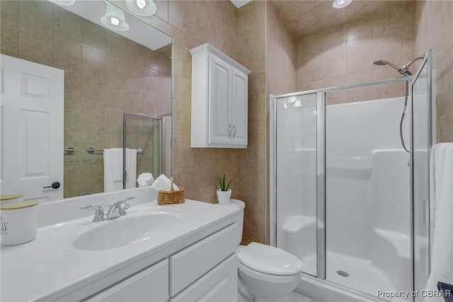118 Old Field Rd, Irvington, VA 22480 - full bath with a shower stall, vanity, tile walls, and toilet