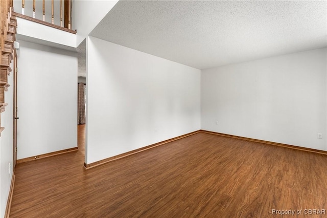 6402 Willow Landing Way, Chester, VA 23831 - empty room featuring wood finished floors, baseboards, and a textured ceiling