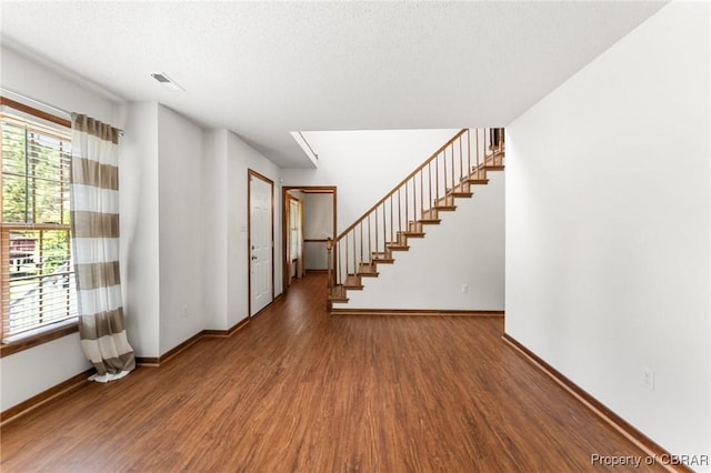 6402 Willow Landing Way, Chester, VA 23831 - foyer entrance with wood finished floors, baseboards, and stairs