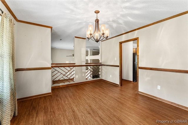 6402 Willow Landing Way, Chester, VA 23831 - spare room featuring ornamental molding, wood finished floors, baseboards, and a chandelier