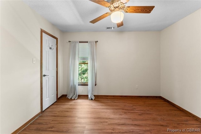 6402 Willow Landing Way, Chester, VA 23831 - unfurnished room with wood finished floors, baseboards, and ceiling fan