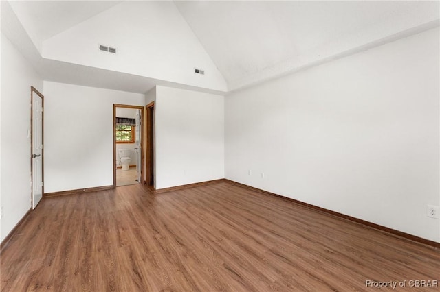 6402 Willow Landing Way, Chester, VA 23831 - empty room with wood finished floors, high vaulted ceiling, and baseboards