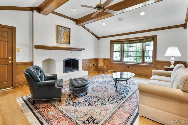 1813 Locust Hill Rd, Henrico, VA 23238 - living room with wainscoting, wood finished floors, a ceiling fan, wood walls, and ornamental molding
