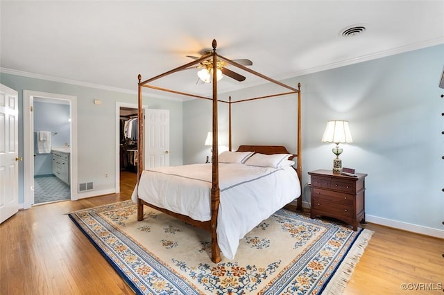 1813 Locust Hill Rd, Henrico, VA 23238 - bedroom featuring wood finished floors, crown molding, a walk in closet, connected bathroom, and a ceiling fan