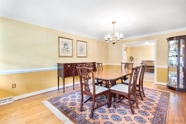 1813 Locust Hill Rd, Henrico, VA 23238 - dining room featuring a chandelier, wood finished floors, and crown molding
