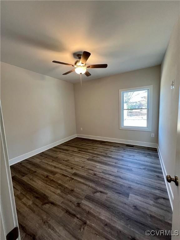 27 Otter Ln, Montross, VA 22520 - spare room with dark wood-style flooring, a ceiling fan, and baseboards