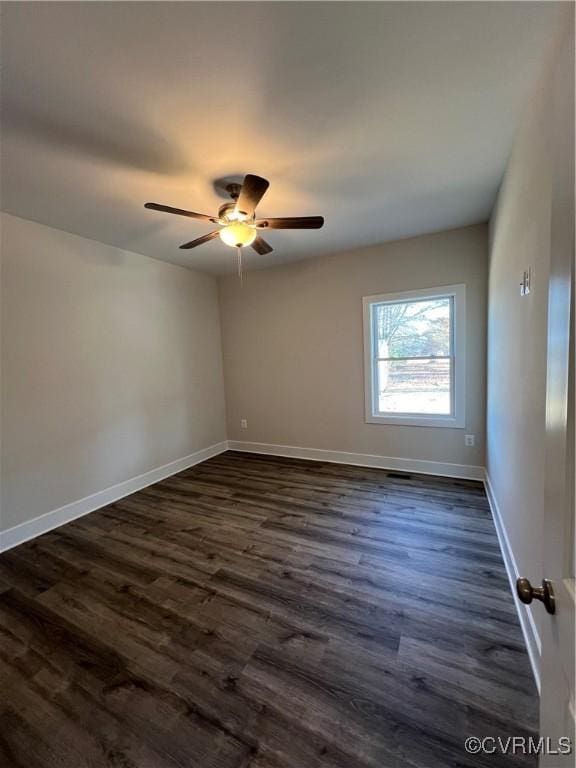 27 Otter Ln, Montross, VA 22520 - empty room featuring dark wood-style flooring, a ceiling fan, and baseboards
