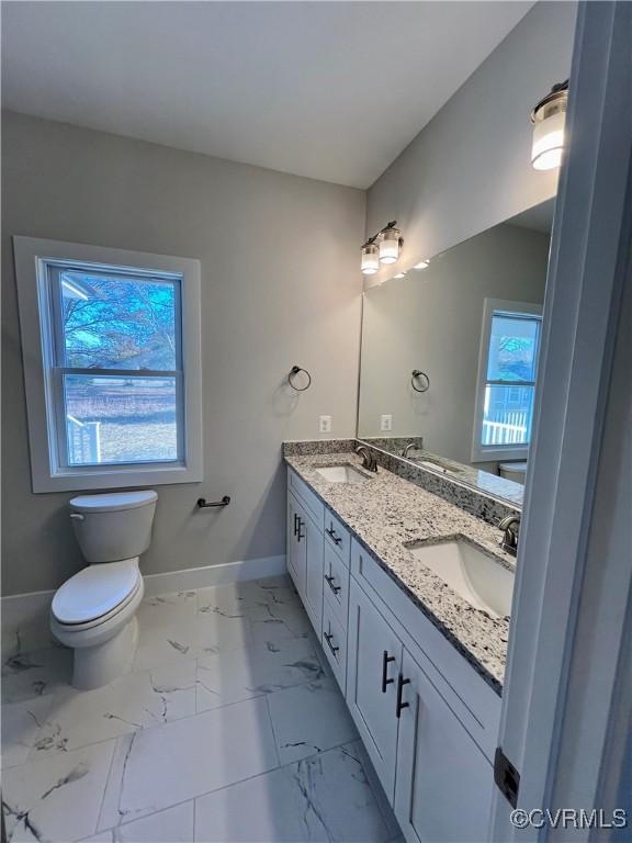 27 Otter Ln, Montross, VA 22520 - bathroom featuring marble finish flooring, baseboards, double vanity, and toilet
