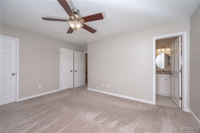 2750 Old Point Dr, Henrico, VA 23233 - unfurnished bedroom with light carpet, ensuite bathroom, a ceiling fan, and two closets