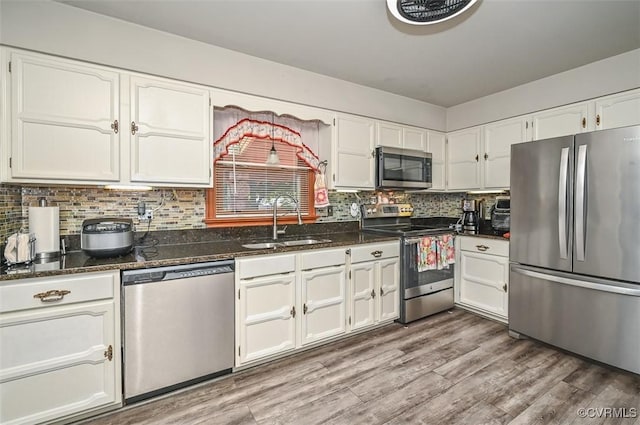 2931 Delfin Rd, Midlothian, VA 23112 - kitchen featuring stainless steel appliances, white cabinets, dark stone counters, and tasteful backsplash