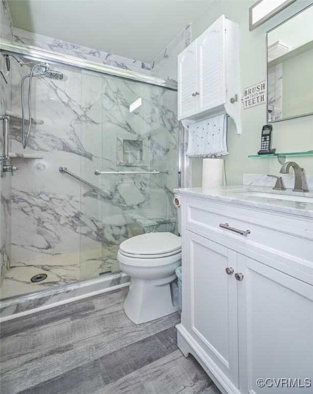2931 Delfin Rd, Midlothian, VA 23112 - bathroom featuring vanity and a marble finish shower