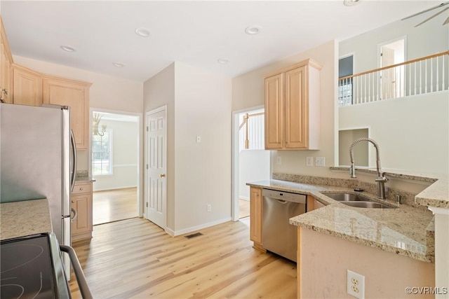 11830 Cedar Landing Ter, Chesterfield, VA 23831 - kitchen with appliances with stainless steel finishes, a sink, light brown cabinetry, light wood-style flooring, and recessed lighting