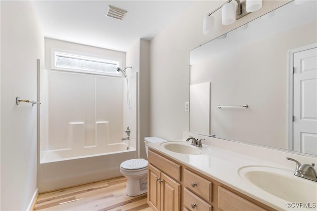 11830 Cedar Landing Ter, Chesterfield, VA 23831 - bathroom featuring toilet, double vanity, wood finished floors, and shower / bathtub combination