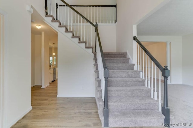 106 Haymaker Pl, Williamsburg, VA 23185 - staircase featuring wood finished floors and baseboards