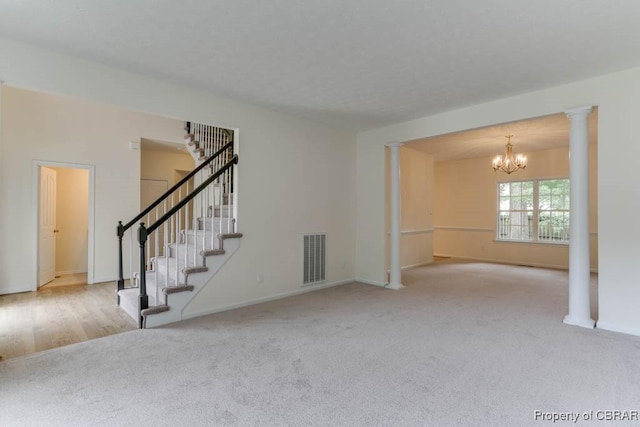 106 Haymaker Pl, Williamsburg, VA 23185 - unfurnished living room featuring carpet, a chandelier, stairs, and baseboards