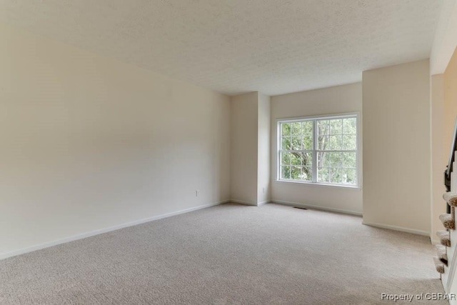 106 Haymaker Pl, Williamsburg, VA 23185 - carpeted empty room with baseboards and a textured ceiling