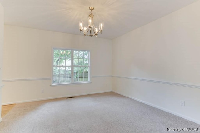 106 Haymaker Pl, Williamsburg, VA 23185 - unfurnished room featuring a chandelier, light carpet, and baseboards
