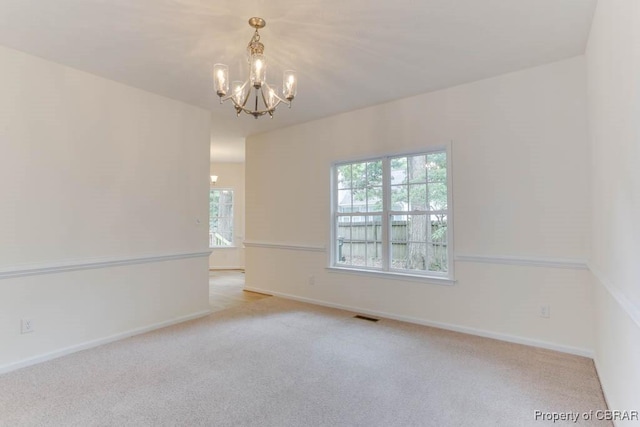 106 Haymaker Pl, Williamsburg, VA 23185 - empty room with a chandelier, healthy amount of natural light, light colored carpet, and baseboards