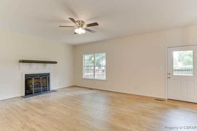 106 Haymaker Pl, Williamsburg, VA 23185 - unfurnished living room featuring light wood finished floors, a fireplace, a ceiling fan, and baseboards